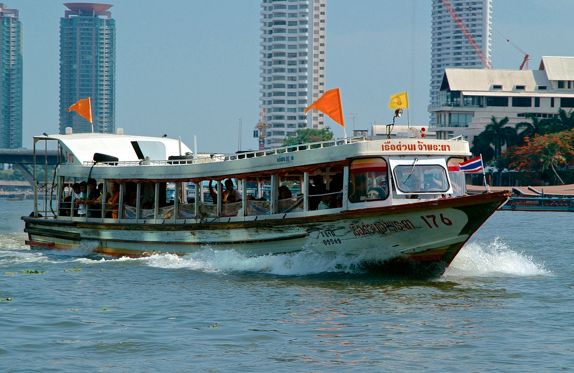 Public express boat service on the Chao Phraya River showing the orange flag (operates on the orange route)